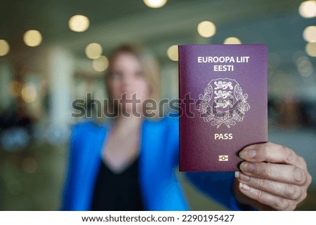 Woman showing europe union passport. Estonian citizenship.