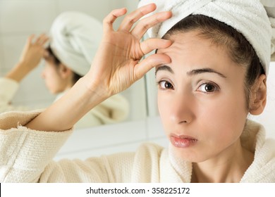 Woman Showing Her Forehead Wrinkles