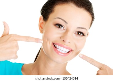 Woman showing her perfect straight white teeth. 