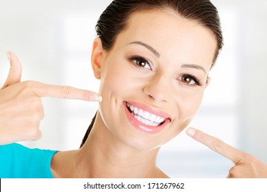 Woman Showing Her Perfect Straight White Teeth. 