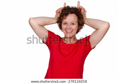 Woman showing horns with her fingers