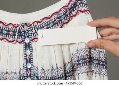 Woman Showing Label Board Price Tag Off New Dress. Clipping  Path