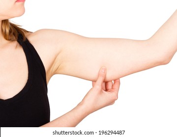 Woman showing loose upper arm thanks to unhealthy lifestyle.