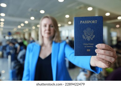 Woman showing passport of United States of America. - Shutterstock ID 2289422479
