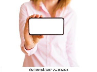 Woman Showing Phone With Horizontal Empty White Screen. Mobile App Mockup.