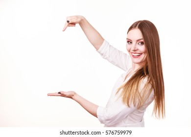 Woman Showing Presenting, Long Haired Fashionable Girl Holding Empty Hand Palm Copy Space For Product. Beauty, Fashion, Advertisement Concept. Studio Shot On White Background