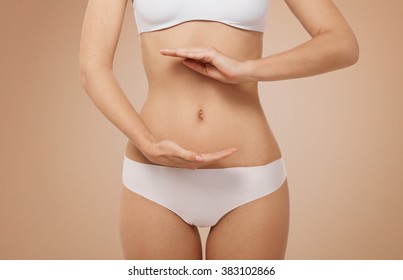 Woman Showing Sign Bio Balance On Her Stomach Isolated 