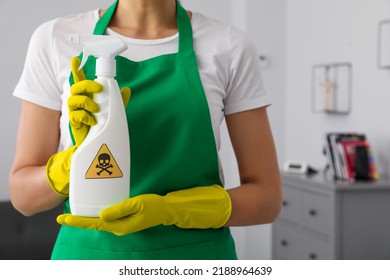 Woman Showing Toxic Household Chemical Spray With Warning Sign, Closeup