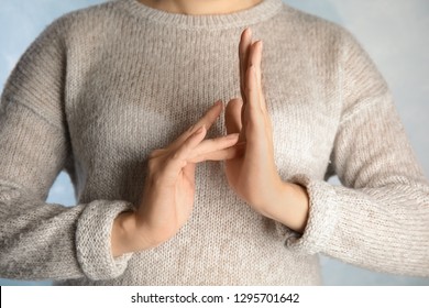 Woman showing word Jesus, closeup. Sign language