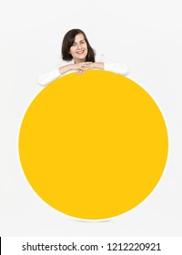 Woman showing a yellow board