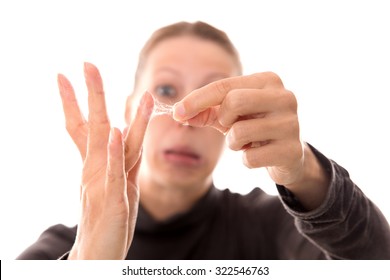 Woman Shows Her Sticky Hands With Cobwebby Fingers, Isolated On White, Concept Spiderwebs 