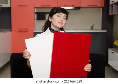 The Woman Shows Samples Of Coatings For The Kitchen Set To Choose The Right Combination Of Colors