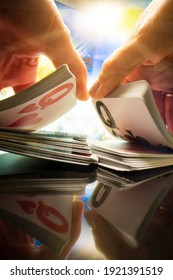 Woman Shuffling Cards At The Casino Table