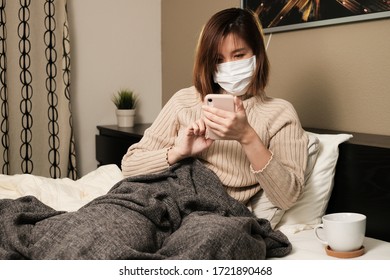 Woman Sick At Home By Coronavirus Cover 19 Pandemic And Stay Home In Bed For Quarantine. Social Distancing And Use Mobile Phone To Connect.