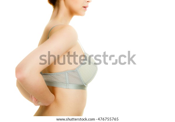 Wife putting on her bra