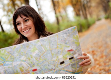 Woman Sightseeing Outdoors And Holding A Map