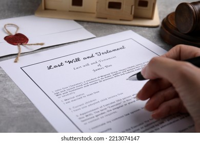 Woman Signing Last Will And Testament At Light Grey Table, Closeup