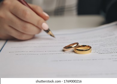 Woman signing marriage contract, closeup