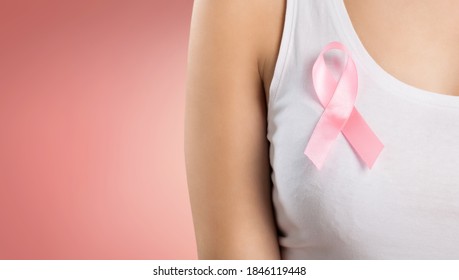 Woman With Silk Pink Ribbon. Brest Cancer Concept