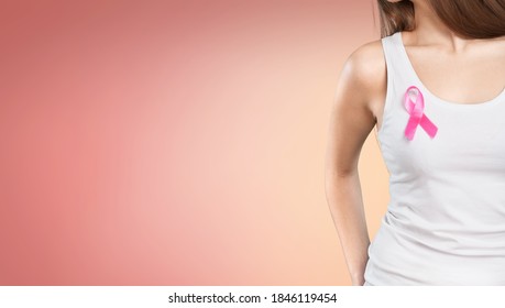 Woman With Silk Pink Ribbon. Brest Cancer Concept