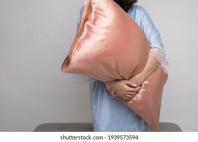 Woman In Silk Sleepwear Kimono Holding A Mulberry Silk Pillow