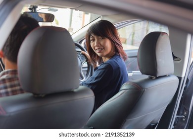 Woman Sit Rear In Car Looking Over Her Shoulder While Driving Travel.