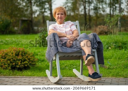 Similar – Senior woman in wheelchair