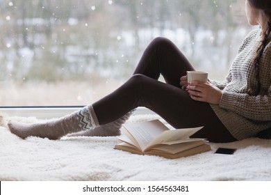 Woman Sitting By The Window, Winter Snow Christmas Concept 