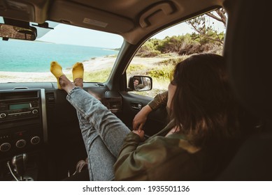 Woman Sitting In Car Looking At Sea. Reflection In Mirror. Copy Space. Vacation Concept