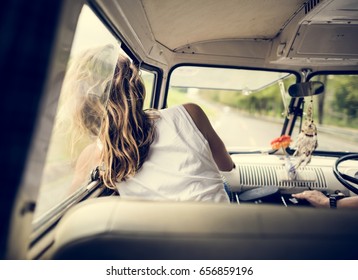 Woman Sitting In A Car Put Head Out Of Window Wind Blowing Her Hair