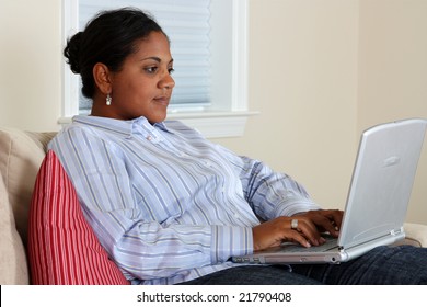 Woman sitting at the computer in her home - Shutterstock ID 21790408