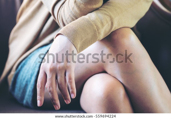 A woman sitting\
cross legged  in the room
