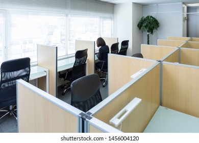 Woman Sitting At Desk And Working