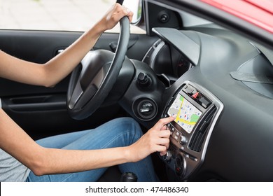 Woman Sitting Inside Car Using GPS Navigation