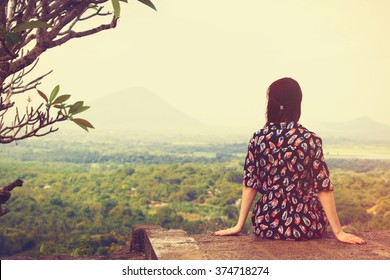 Woman Sitting And Looking On The Landscape 