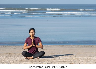  Woman Sitting In A Namaskar Pose. Yoga At A Beach, Morning, Jogging, Workout, Exercise, Healthy Life, Diet, Lifestyle, Sedentary, Active, Fit, Fresh, Fitness, Periods, Sunlight, Muscle, Life Balance