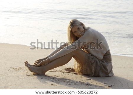 Similar – Young, slender, long-legged woman on a Baltic beach in a summer dress