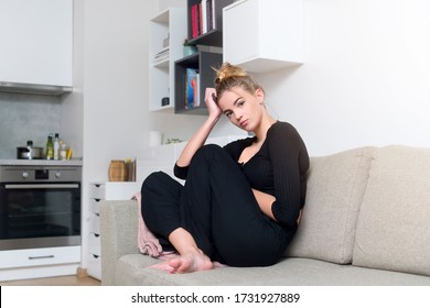 Woman Is Sitting On The Bed Looking Out To The Windows And Thinking Or Missing Of Someone.
