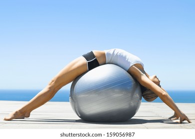 Woman Sitting On Exercise Ball