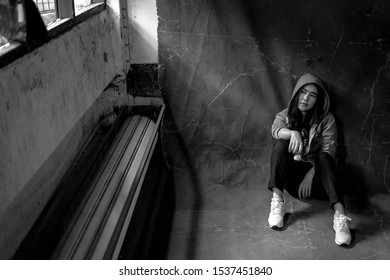 Woman sitting on the floor with substance abuse, substance abuse, addiction, people and drug use concept, copy space background for text.