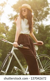 Woman Sitting On Her Fixed Gear Bike.