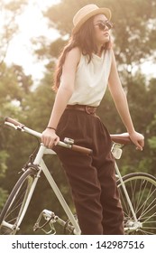 Woman Sitting On Her Fixed Gear Bike.