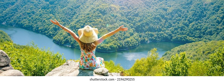 Woman Sitting On The Mountain Peak And Amazing View Of Dordogne River And Forest