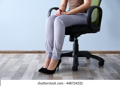 Woman Sitting On The Office Chair Indoors