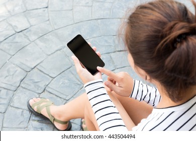 woman sitting and use phone in city modern lifestyle - Powered by Shutterstock