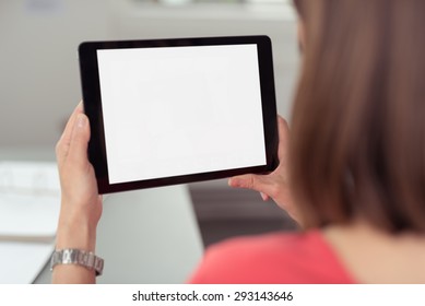 Woman Sitting And Using A Black Wireless Tablet PC With White Blank Touch Screen Or Interface, Rear