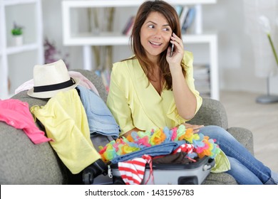 Woman Sitting Using Cordless Phone