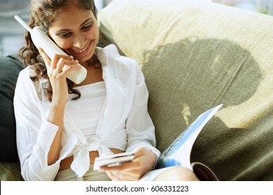 Woman Sitting, Using Cordless Phone