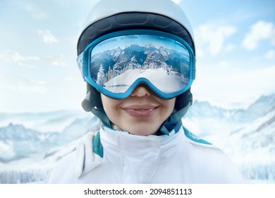 Woman At The Ski Resort On The Background Of Mountains And Blue Sky.A Mountain Range Reflected In The Ski Mask. Winter Sports.