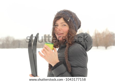 woman with skies close up winter snow park portrait